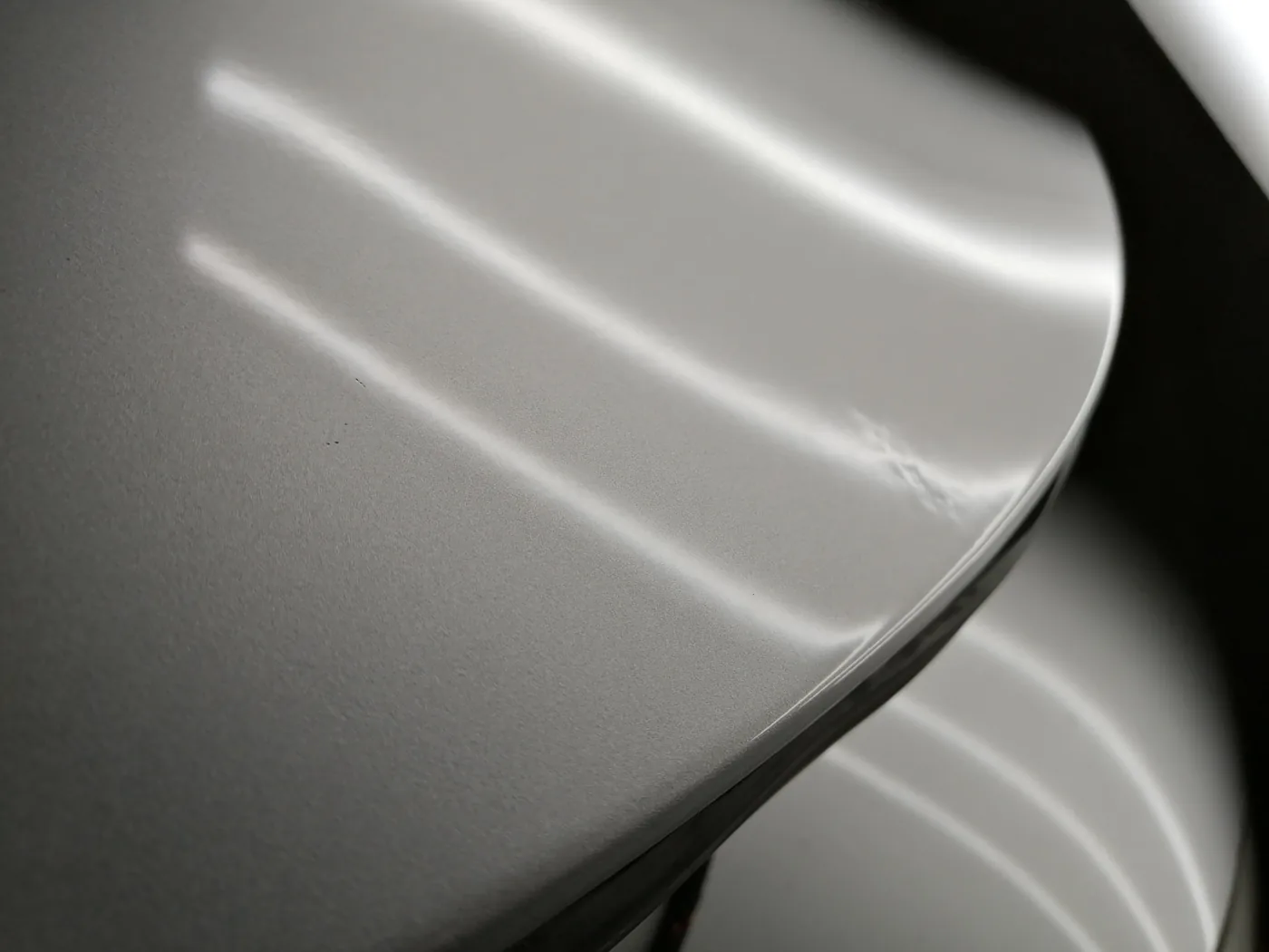 Same silver panel after paintless dent repair